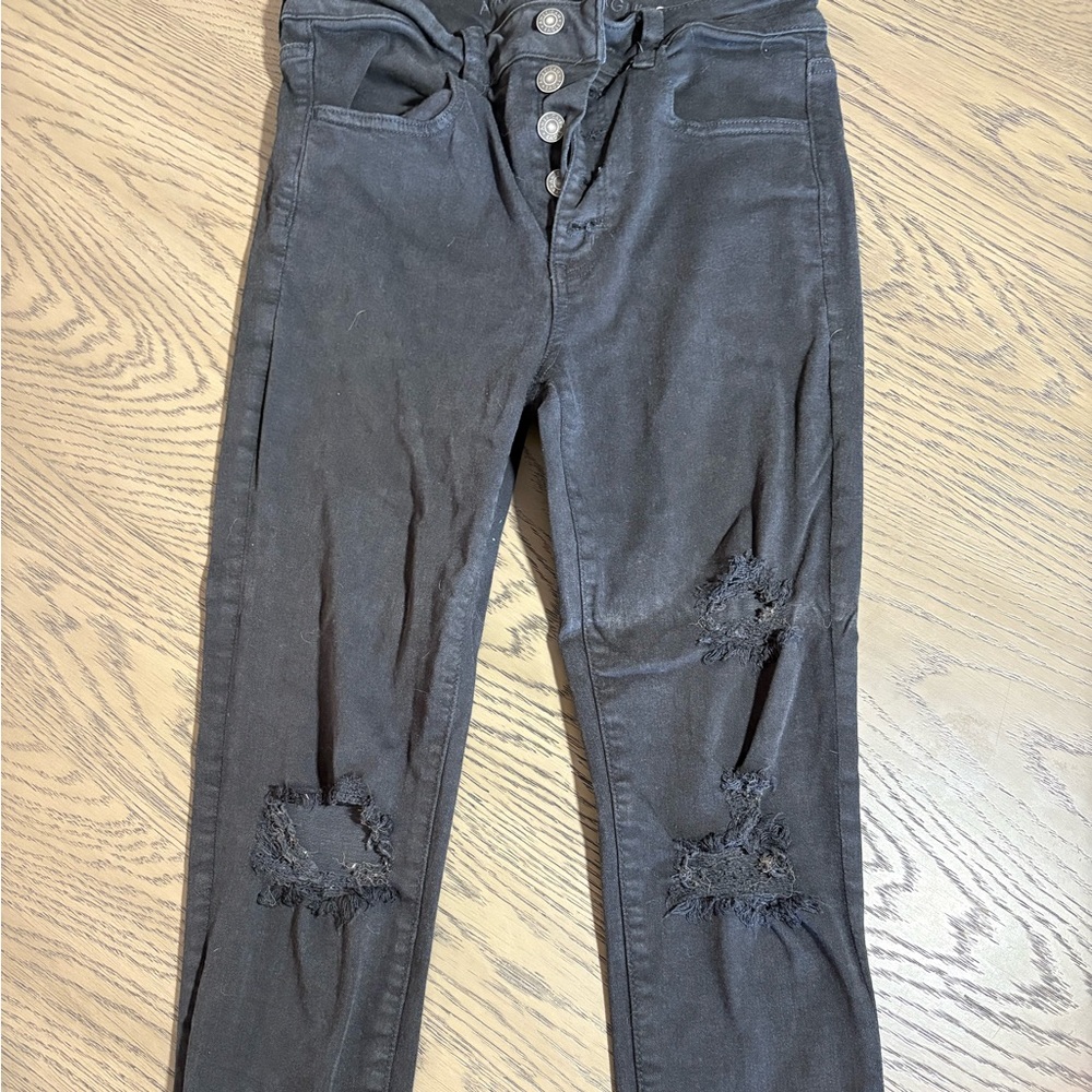 American Eagle washed black skinny jeans with rips